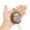 Vòng cổ Kalimba mini bao gồm luyện tập chơi đàn piano bằng gỗ ngón tay cái